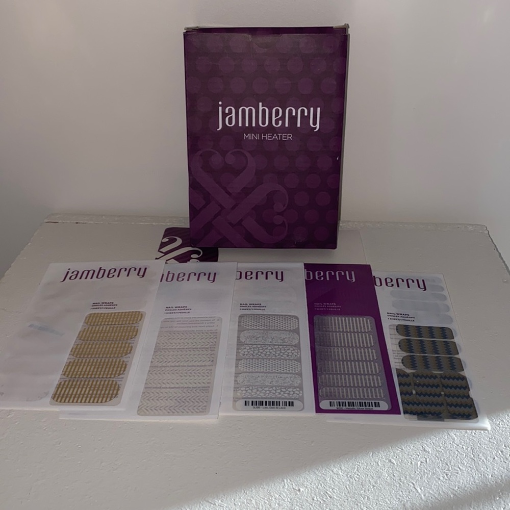 Jamberry mini heater and 5 nail wraps. Only 1 nail wrap has some missing.